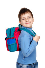 Smiling schoolboy. Isolated over white background.