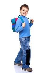 Smiling schoolboy. Isolated over white background.