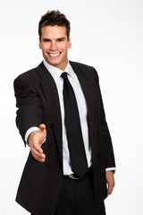Friendly smiling businessman. Isolated over white background.