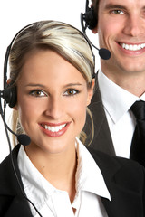Smiling  business people  with headsets. Over white background .