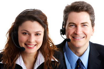 Smiling  business people  with headsets. Over white background .