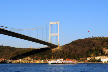 Istanbul Turkey. Ferry passing by Bosphorus bridge