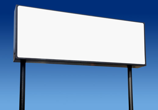 Long white billboard and a blue sky.