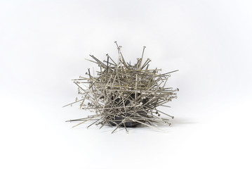 group of needles magnetickly attached to a square magnet
