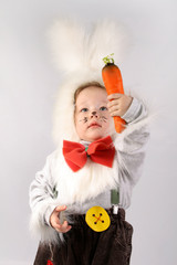 Child in a white downy bunny costume.