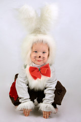 Ñhild in a white downy bunny costume.