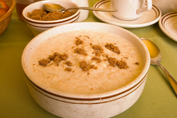 Porridge sprinkled with dark brown sugar