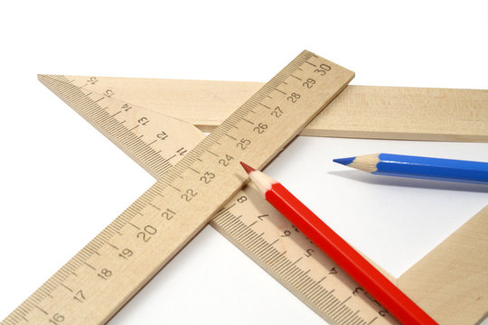 Two coloured pencils and two wooden rulers