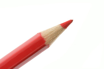 Red pencil close-up isolated over white background
