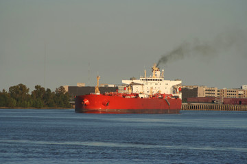 Obraz premium oil tanker with smoke from funnel