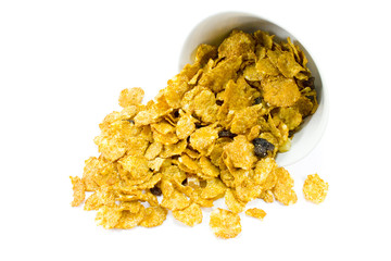 cornflakes from bowl isolated over white