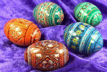 Painted Easter Eggs over Purple Background.