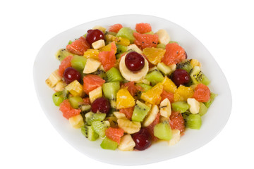 Colorful fruit salad isolated on white