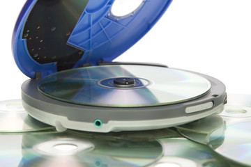 Compact discs and round  blue cd player
