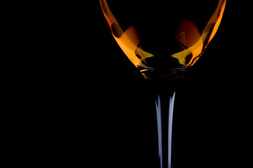 full wine glass on the black background