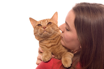 A teenaged girl holds her pet cat