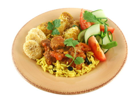Beff vindaloo curry on tumeric rice with a side salad.