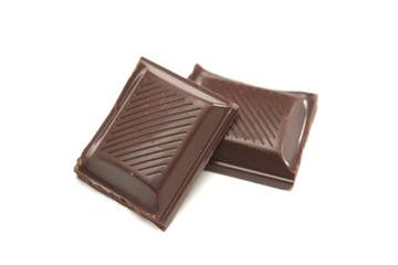 Two segments of chocolate on a white background