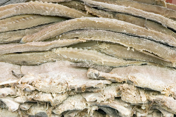Pile of dried and salted codfish fillets