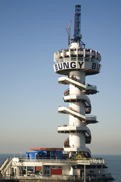 tower at the pier used for bungee-jumping