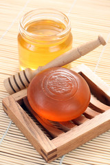 bar of gliceryne soap and jar of honey - natural bath