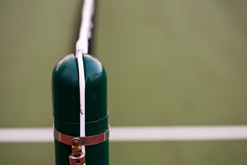 A close up shot of a tennis net pole (shallow DOF)