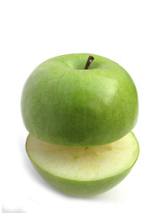 Green apple cut isolated on white background