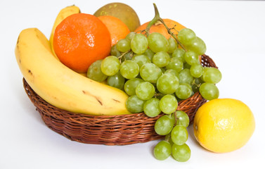 Naklejka na ściany i meble Basket with fruit isolated on white
