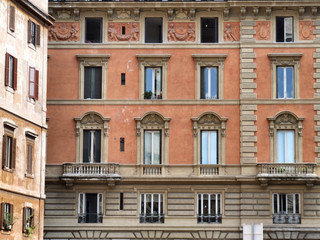Fototapeta na wymiar Rome windows. Typical architecture of Italian capital city.