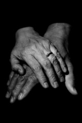 Fototapeta premium A couple of mature couple holding hands in black and white