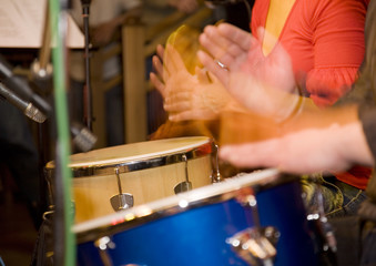 expressing bright shot of hands on the drums