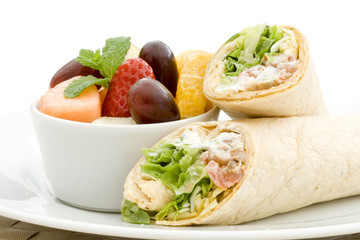 Fruit salad and tortilla wraps for a healthy lunch