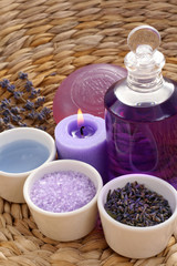 Obraz na płótnie Canvas aromatic lavender bath - bath salt bath gel and lavender flowers