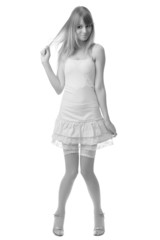 beautiful blonde playful young girl in childish clothes