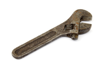Old adjustable spanner, isolated on white background