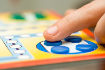 Fototapeta premium Funny board game played with colored buttons