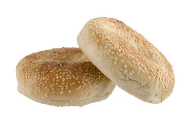 Two bagels with sesame seeds isolated on white