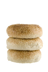 A line up of three bagels isolated on a white background