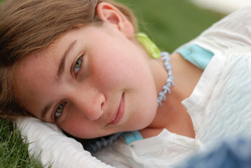 young and happy girl is enjoying herself outdoors