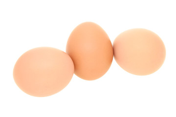 Three fresh eggs isolated on white background