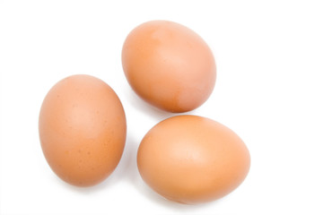 three eggs on the white isolated background