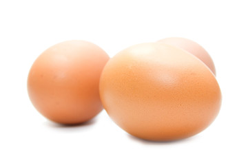 three eggs on the white isolated background