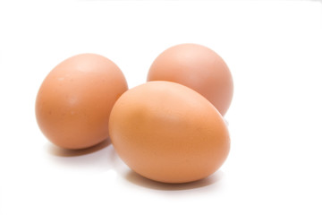 three eggs on the white isolated background