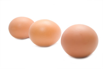 three eggs on the white isolated background