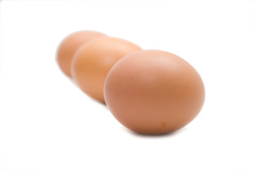 three eggs on the white isolated background