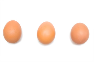 three eggs on the white isolated background