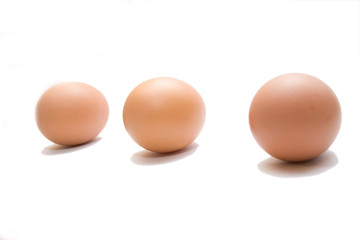 three eggs on the white isolated background