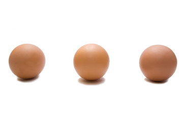 three eggs on the white isolated background