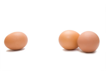 three eggs on the white isolated background