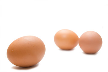 three eggs on the white isolated background